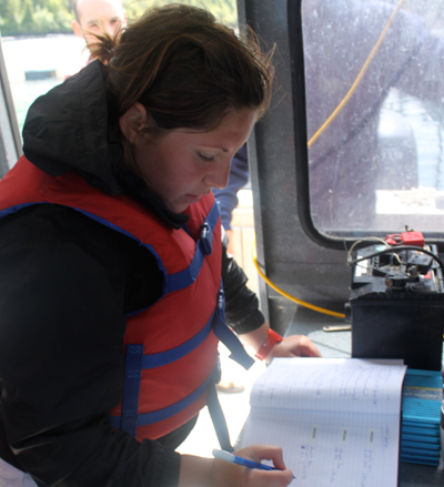 Lindsay Brager recording data at the Kyuquot SEAfoods Ltd. IMTA farm site