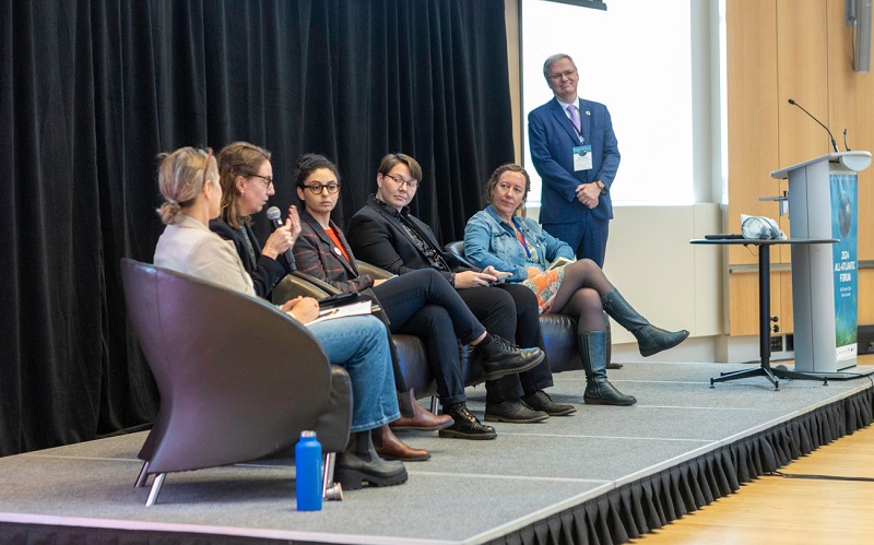 International experts on stage engaged in a dialogue on ocean literacy, co-design, diversity, equity, and inclusion. 