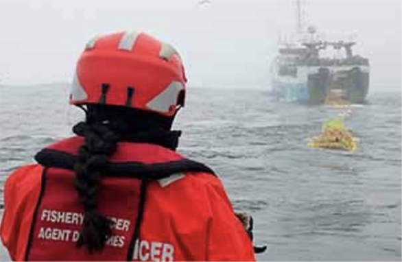 DFO At-Sea Observer watching a fishing vessel